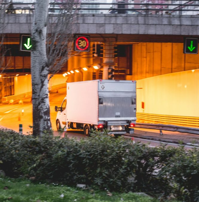 yellow and white building near bare trees during daytime